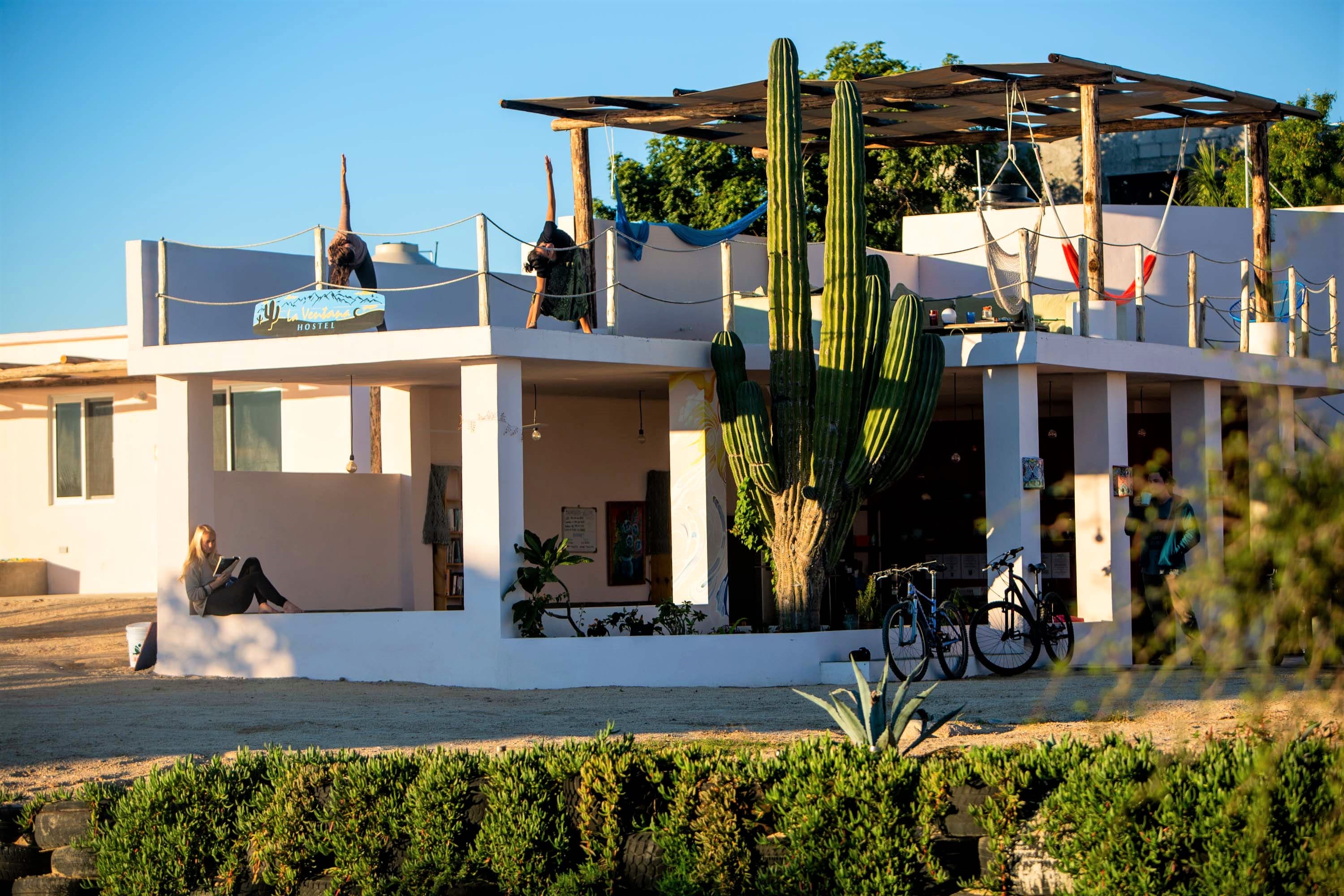 La Ventana Hostel exterior at golden hour — boutique hostel with rooftop terrace and giant cactus, five minutes from the beach