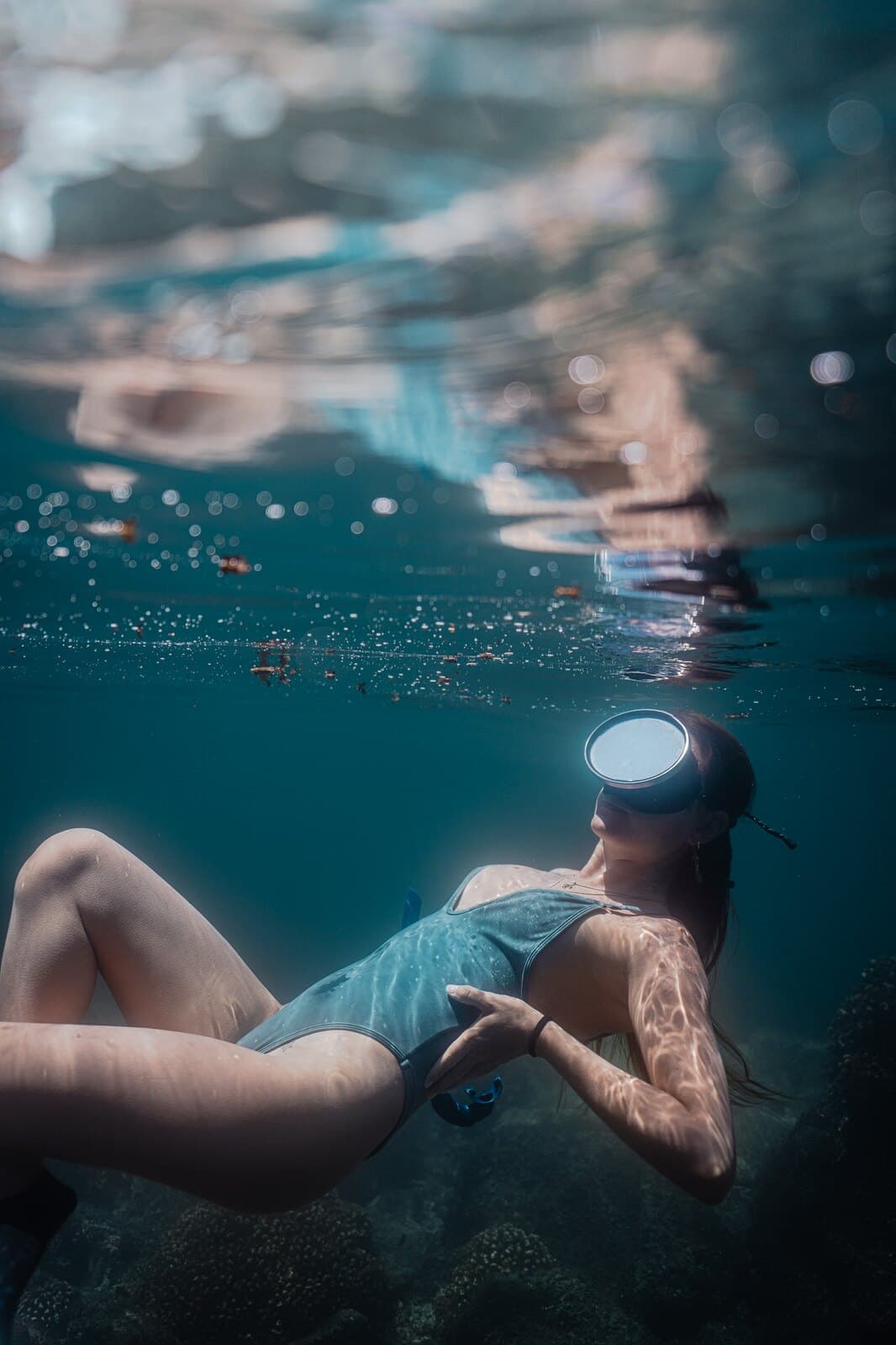 A freediver floating just below the water's surface