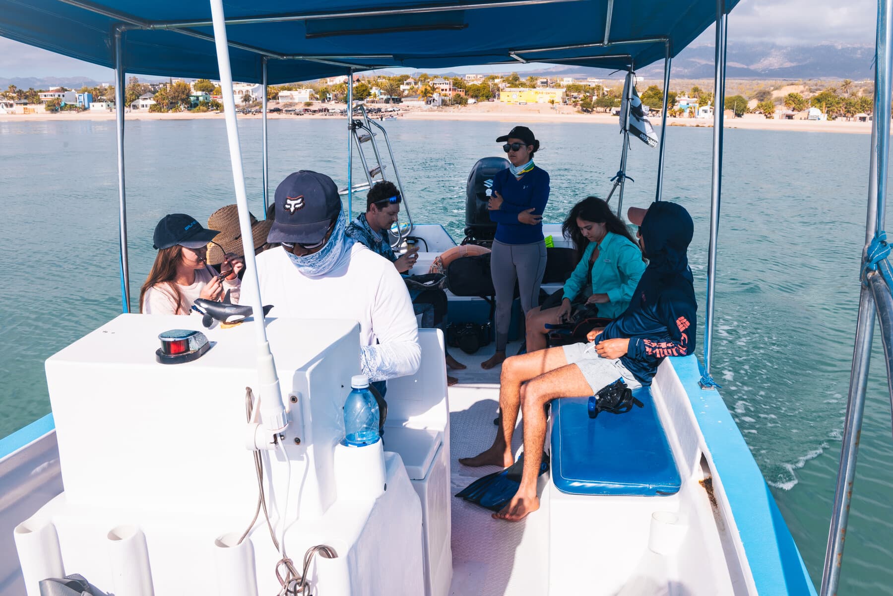 Guests aboard a covered panga during an Ocean Safari day trip