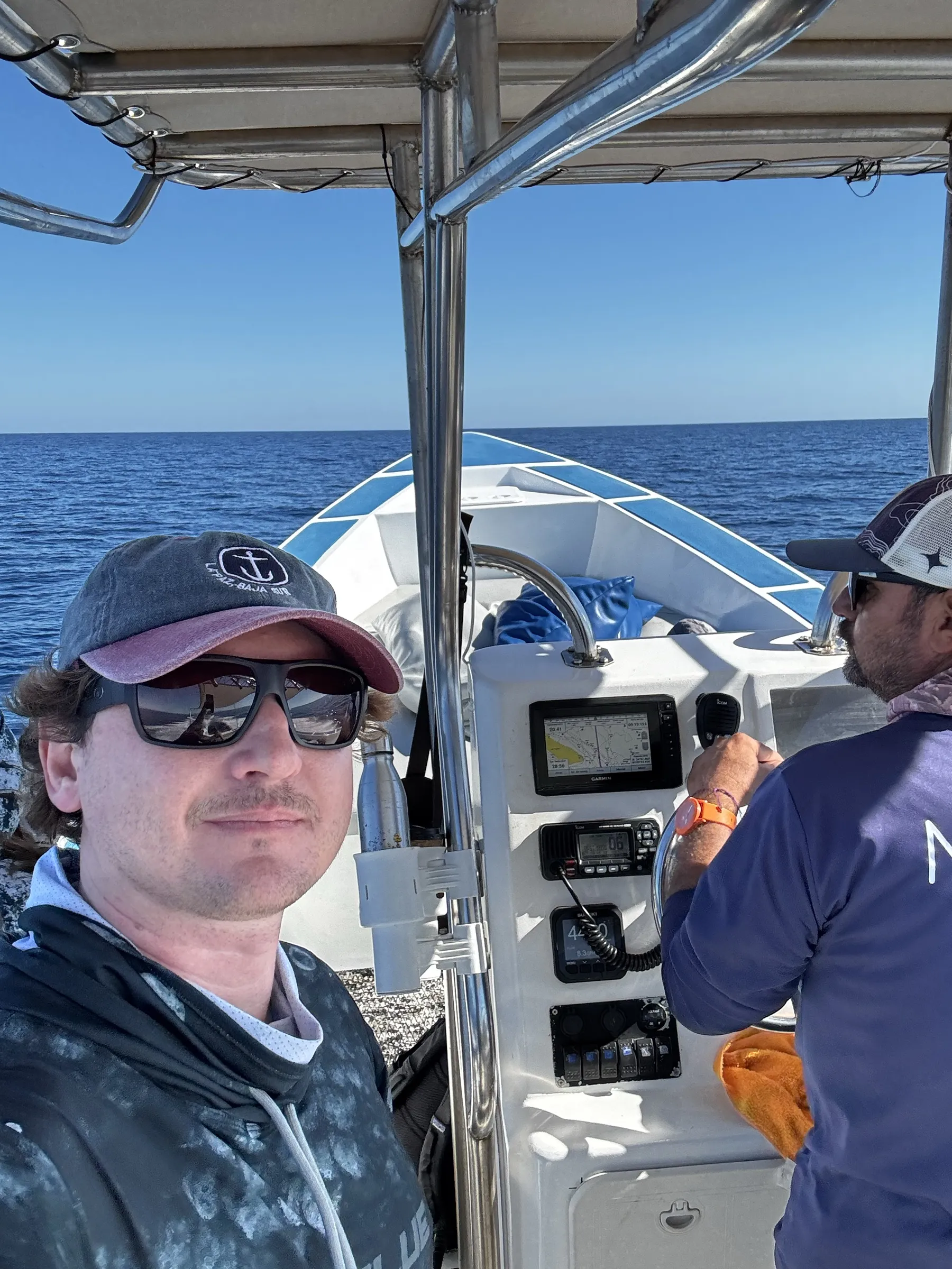 A guest and the captain aboard the private panga